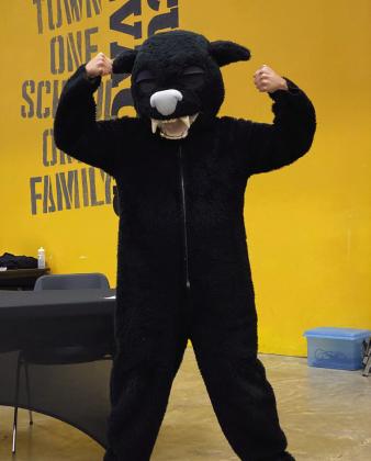 Victor Cope models a panther mascot in his continued quest of encouraging the board to reconsider the savage name. He reminded them that as long as a “savage” was the mascot, the school could never have a cute mascot such as this. Countywide &amp;amp; Sun/Julie Talton