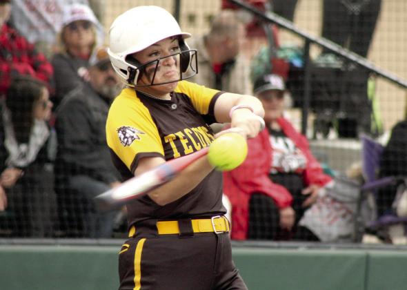 Tecumseh senior Abbi Jordan gets a hit during the Class 5A Slow Pitch Quarterfinal game against Elgin, held at FireLake Ball Fields on May 5. The Lady Savages lost, 5-15, and end their season with a record of 28-13.