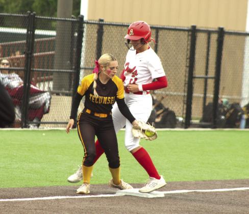Tecumseh senior Blakelee Parker tries to tag an Elgin runner at third base during the Class 5A Slow Pitch Quarterfinal game, held at FireLake Ball Fields on May 5.