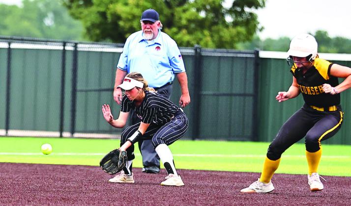 The NRC softball team took on Tecumseh at Firelake. The Tecumseh runner on 2nd base had second thoughts when Izzy O'Daniel got the hard-hit ball. Photo Courtesy of Gowin Photography