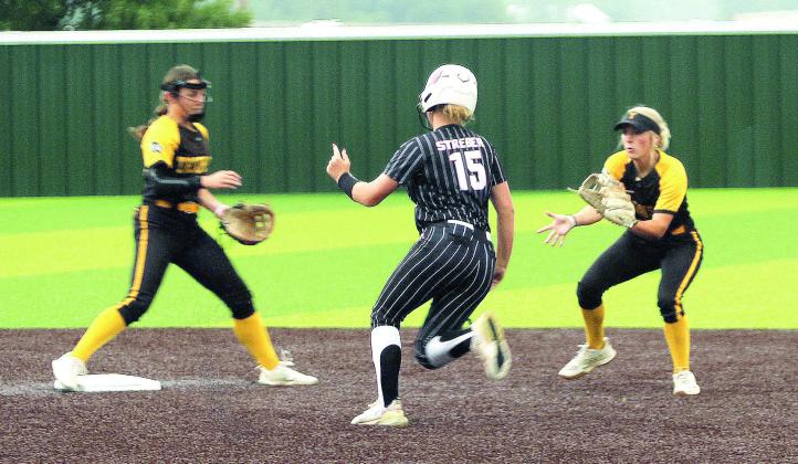 North Rock Creek freshman Kassidy Streber runs to second base as Tecumseh seniors Cadence Leba and Blakelee Parker wait for the catch during the game with Tecumseh at FireLake Ball Fields on Aug 29. Cheyanna Dietz, Countywide &amp; Sun