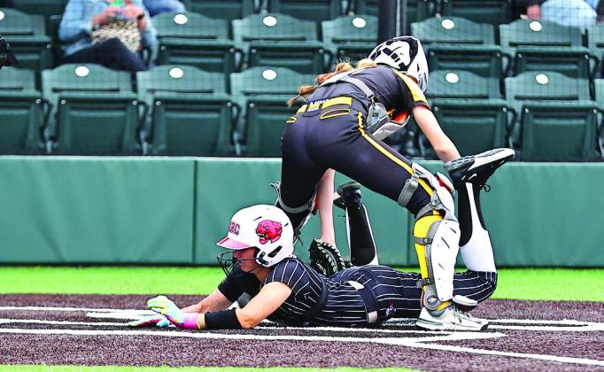 NRC's Aubree Shivelhood slides between the Tecumseh catcher's legs. Photo Courtesy of Gowin Photography