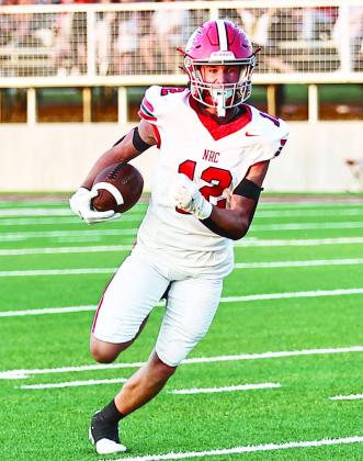 C.J. Stephens looks toward the Red Devil's end zone in the Sept. 12 game at Prague.