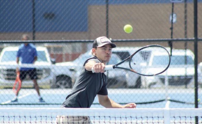 Tecumseh senior Xzavier Kommer counters with a backhand stroke during the Shawnee NGB Tournament, held at SHS and OBU on May 2. Kommer competed in #1 Doubles wtih Eli Mullins. Natasha Dunagan, Countywide &amp;amp; Sun