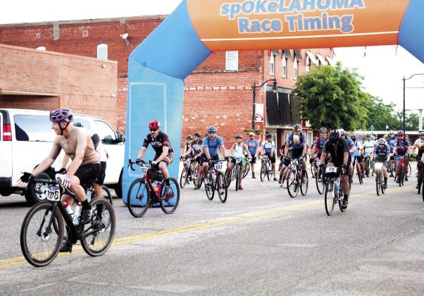 About 58 bicyclists from all over Oklahoma take off on the Fenrir Unchaind bike race, starting in front of spOKeLAHOMa in Tecumseh, on June 3. Participants could choose from four distances: 39, 70, 140 and 210 miles. Ryan Roggow of Shawnee placed first in the 210-mile “Ragnarock” race. Craig McIntyre, co-owner of spOKeLAHOMA, said there were 95 people who registered from five states and New England. Countywide &amp; Sun/Natasha Dunagan