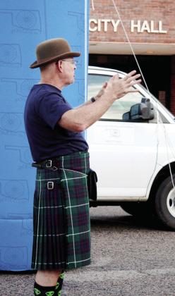 Craig McIntyre, co-owner of spOKeLAHOMA in Tecumseh, talks with participants in the Fenrir Unchaind bike race before they depart on June 3. McIntyre wears his traditional kilt during events. Countywide &amp; Sun/Natasha Dunagan