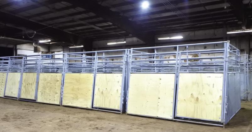 A long row of refurbished stall panels have new wood and straightened or replaced steel pipe. The panels are ready to be painted and then be set for the upcoming horse show. File photo