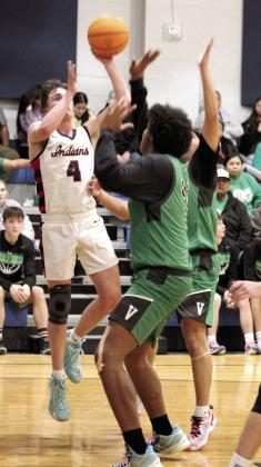 Asher’s Kelby Fowler takes a shot in the Jan. 2 home game with Varnum. The Indians won, 59-48.