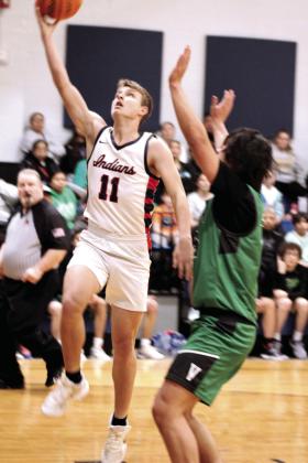 Asher’s Andrew Overstreet tries for a layup in the Jan. 2 home game with Varnum. Countywide &amp; Sun/Natasha Dunagan