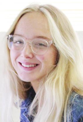 Tecumseh High School Senior Delaney Brown sits at her desk at the “Countywide &amp;amp; Sun” on April 4, where she is an intern three days a week. Brown enjoys English, journalism, managing softball, FCA, and also interning at the Tecumseh Chamber of Commerce. Countywide &amp;amp; Sun/Natasha Dunagan
