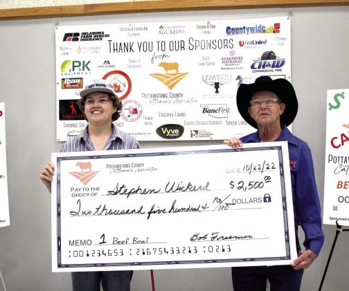 Pottawatomie County Cattlemen’s Association President Bob Freeman, right, presents an oversized check for $2,500 to North Rock Creek sophomore Stephen Wickerd, who won first place in the inaugural Beef Quiz Bowl on Oct. 22. Countywide &amp;amp; Sun/Natasha Dunagan