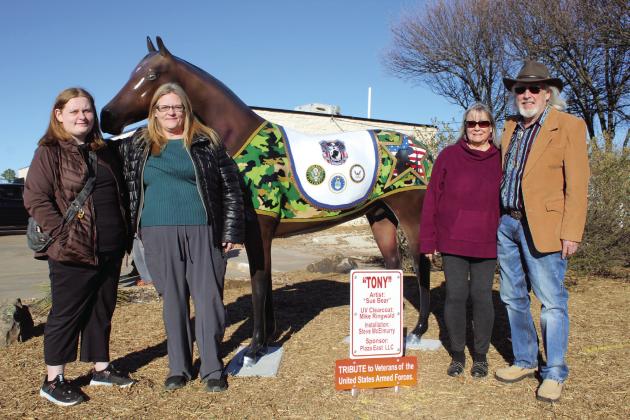 Artist Sue Bear, second from left, with her daughter Janie Lynn Johnson, and Dana and David Taylor, the owners of the Plaza East Labyrinth Office Park, at 722 E. Independence in Shawnee, pose with Tony, the latest “Horse in the City,” on Jan. 16. Tony is a tribute to the Veterans of the United States Armed Forces and has been a work in progress for about three years. Countywide &amp; Sun/Natasha Dunagan