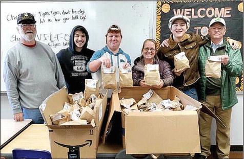 The patrons of the Tribbey Senior Center collected donations of hats and gloves (or monetary donations) that ended Dec. 2. On Wednesday, Dec. 14 the items were presented to the Wanette School administration with a pair of gloves going to each student in the district. Photo provided