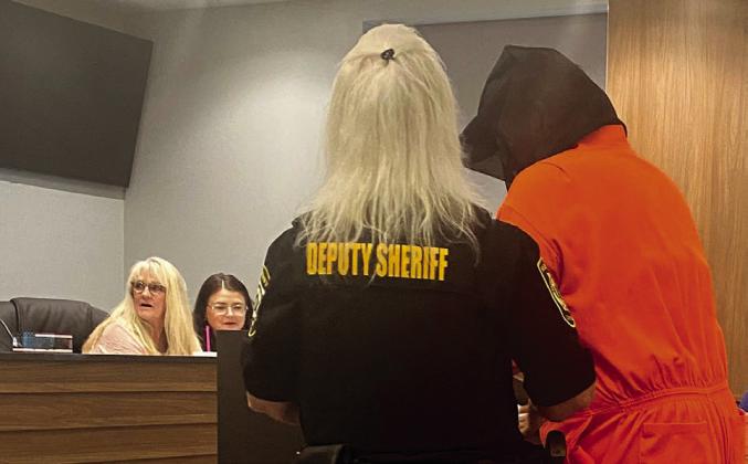 Deputy Sheriff Candie Griffin escorted her prisoner to the podium to address the commission. Clerks, Raeshel Flewallen and Stephanie Hutchcraft seemed slightly concerned. Julie Talton, Countywide &amp; Sun