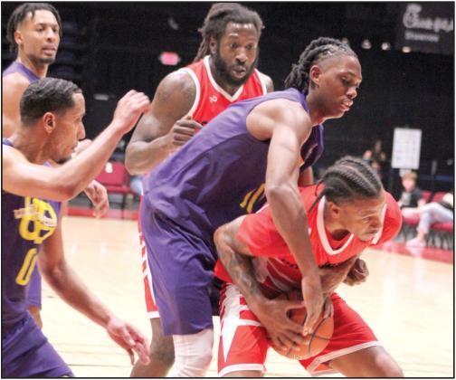 Potawatomi Fire Power Forward Ruston Hayward, of Houston, TX, fights for the rebound against a Creating Young Minds (CYM) defender in the fourth quarter of the Exhibition Game on Feb. 24.