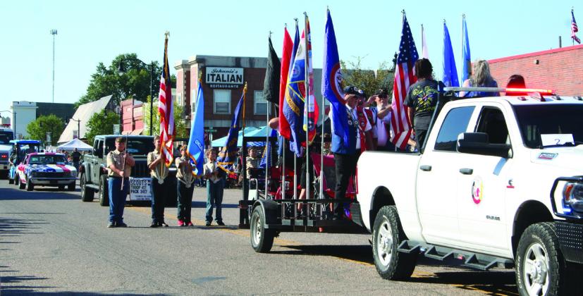 Local Scouts and the Citizen Potawatomi Nation Color Guard stand at attention while the flag salute is given during the Frontier Days Parade on Sept. 30, 2023. File photo.