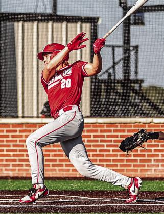 Hunter Bertram watches the ball go over the fence for a home run.
