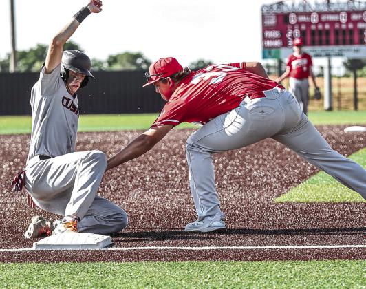 Kason Johnston tags a Cushing runner for the out.