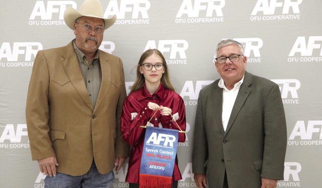 Bethel 4-H Member Ember Luna poses with AFR Cooperative Vice President Toby Wallace, left, and AFR Cooperative President Scott Blubaugh after winning third place in the AFR Central District Speech Contest Junior Division on Nov. 10. Photo provided