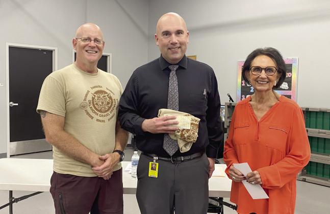 Craig MacIntyre, Robert Kinsey and Linda Capps pose at the Tecumseh School Board Meeting where spOKeLAHOMA’s Oklahoma Gravel Growler event hosted a fundraiser and Citizen Potawatomi Nation wrote a check for $2,423 to TPS. Countywide &amp; Sun/Julie Talton