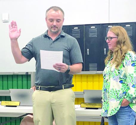 Stephen Kingham is sworn in by Tecumseh Public School Board Presidet, Iva Bingham at the June meeting. Kingham fills seat #4, previously held by Tim Underwood. Countywide &amp; Sun/Julie Talton