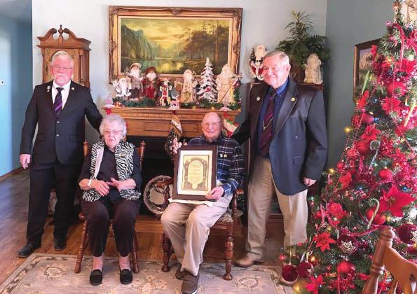 Raymond Talley, formerly of Tecumseh, accepts his 75-Year Masonic Service Certificate and Pin at his Stillwater home in Dec. Shown, from left, are Oklahoma’s Grand Master M.W. Scott Vincent, Myrna Talley, Raymond Talley, and Oklahoma’s Grand Warden R.W. James Roderick. Photo provided by Susan Cockrell.