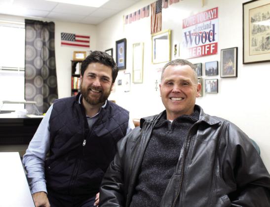 Justin Wood, the Tecumseh Public Schools Director of Community Engagement, poses with his father, Freeland Wood, who is the Pottawatomie County Sheriff Elect. F. Wood was a police officer for the City of Shawnee, Shawnee High School and North Rock Creek for 36 and a half years before winning the Sheriff’s election this year. Countywide &amp;amp; Sun/Natasha Dunagan