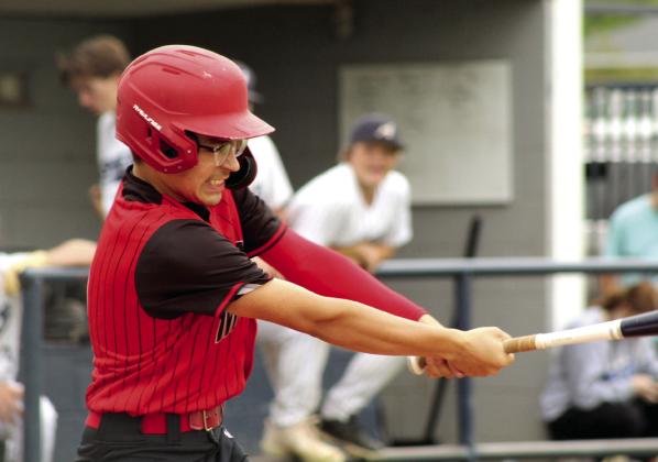 Macomb sophomore Gavin Blaine gets a hit during the first inning of the Class B District Baseball Tournament at Asher on April 22.