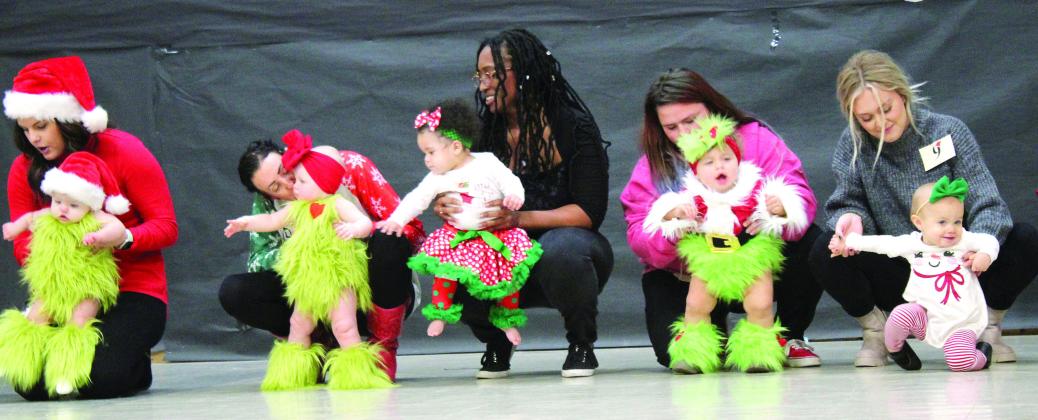 Girls in the 10-23-months division compete in the 28th Annual Christmas Miss &amp;amp; Mister Pageant on Dec. 3 at Will Rogers Elementary in Shawnee. Assisted by their mothers, they are Hattie Jo Yount, Emberlynn Gallow, Mia Vernor, Jasper Valencia and Quinnley Fleming. Countywide &amp;amp; Sun/Natasha Dunagan