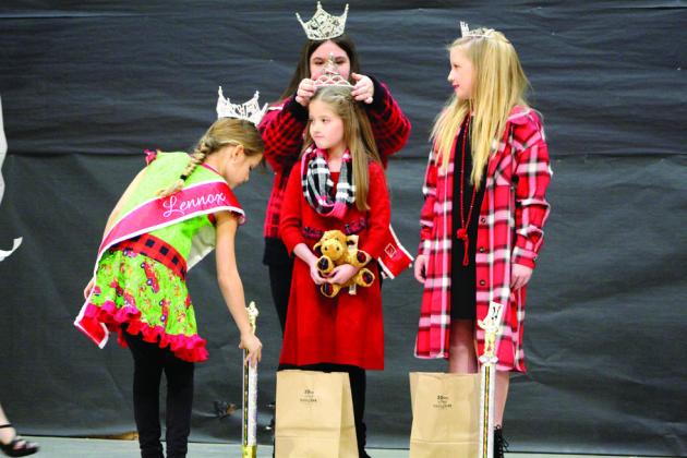 Lily Timmons, of Shawnee, is crowned Overall Christmas Queen for the 10-12-year division of the Christmas Miss &amp;amp; Mister Pageant on Dec. 3. Katie Penfold, right, won Most Photogenic and Christmas Fashion Queen.