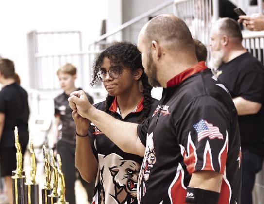 The NRC Archery teams participated in the Meeker Annual Turkey Tourney. NRC Elementary and Middle School finished 1st and the HS finished 2nd. Angela Rodea is shown getting encouragement from Coach Rogers after she shot a 279,finishing 4th in overall girls. Photos courtesy of Gowin Photography