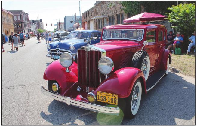 A 1932 Oldsmobile "Hupmobile" Series F222 glints in the summer sun during the City of 5 Nations Downtown Auto Show &amp; Shine in downtown Shawnee on July 16. The car is owned by Louis Hopper, of Tecumseh, who said he bought the car in June 1987, has done all the welding and mechanic work, and has driven it since 2003. Countywide &amp; Sun/Natasha Dunagan