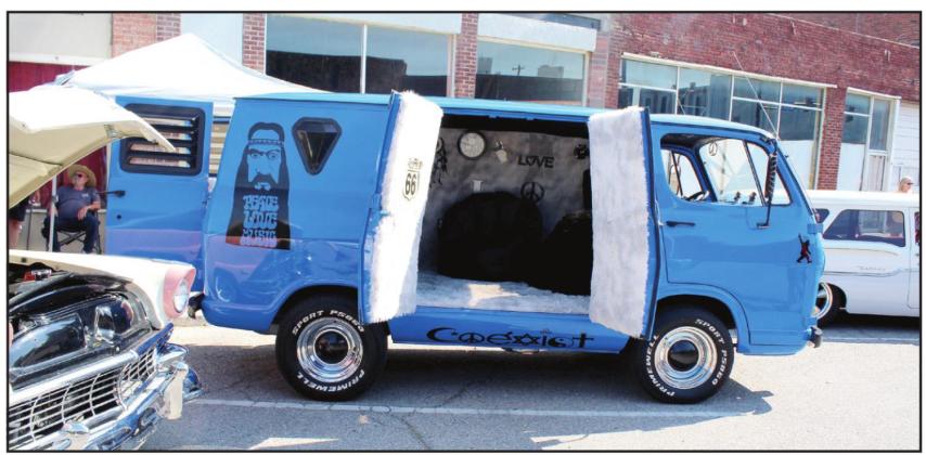 During the City of 5 Nations Downtown Auto Show &amp; Shine in Shawnee on July 16, one of the entries was a 1964 Chevy G-10 van with a hippie theme. It is owned by John Fiely, of Norman, who said, "You gotta see them smile at car shows. It's not just 'here's my car.'" Fiely has owned the van for 12 years and changes up the theme occasionally for shows. He said it took him two months to work on the paint job this time. Fiely won the "Special Interest" category. Countywide &amp; Sun/Natasha Dunagan