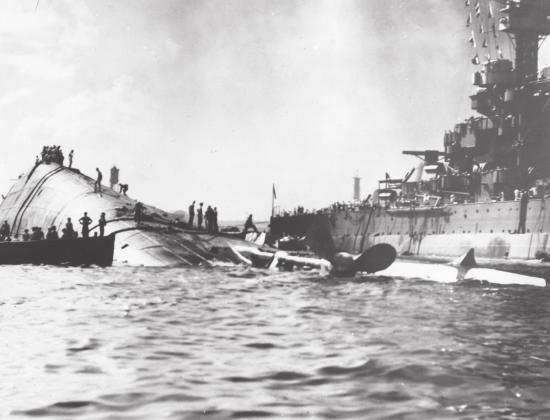 USS Oklahoma capsized next to the USS Maryland. Photo provided