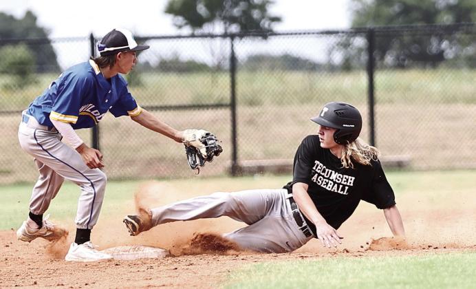 Tecumseh’s Zach Walker is safe sliding into second in action Monday between Bethel and Tecumseh