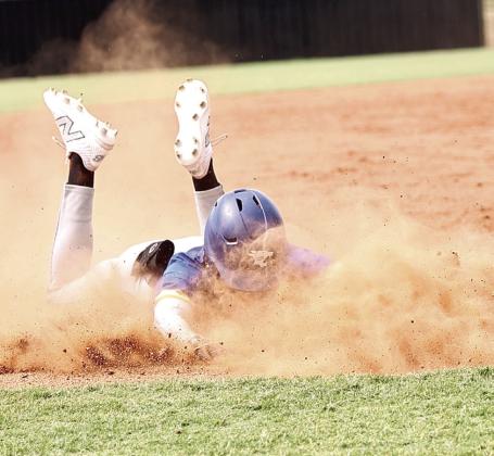 Bethel’s Zack Jennings does a headfirst slide and comes up safe at third. The summer league baseball tournament began Monday, June 24 at Dale and North Rock Creek. At NRC Bethel, Tecumseh, NRC and Prague competed. NRC won both of their games and Tecumseh split theirs.