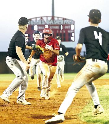 North Rock Creek’s Kona Paningsoro gets into a pickle but gets to go to on to third after an interference call.