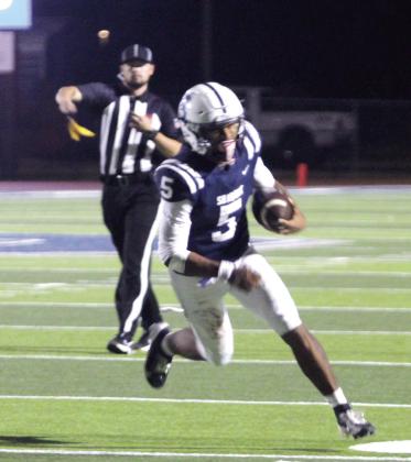 Shawnee senior Braylon Lassiter runs for the endzone, but the play is called back for holding, during the Pink Out home game against Coweta on Oct. 10. The Wolves lost 14-38, for a record of 3-3. Natasha Dunagan, Countywide &amp;amp; Sun