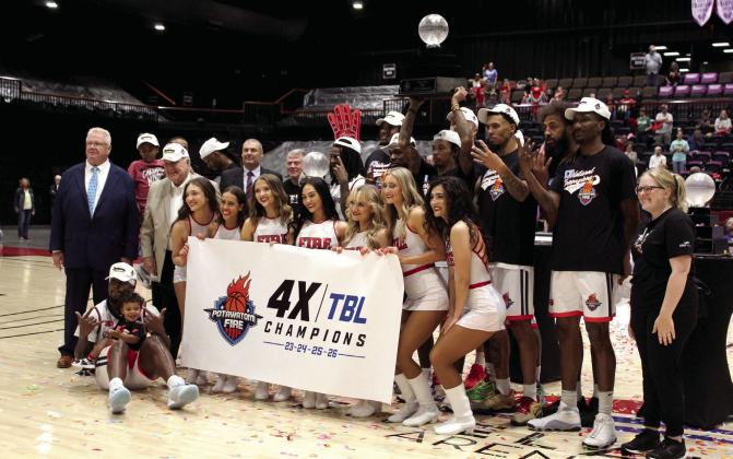 The Potawatomi Fire TBL basketball team and everyone who contributed to their success pose after winning their fourth straight national championship finals on June 19 at FireLake Arena. The Fire won the June 19 game, 125-110, after taking the first game on June 18, 151-114, both against the Tri-City Tide from Canada. According to potawatomifire.com, this is their second year to be undefeated, with a 24-0 record this season.