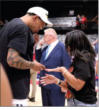Potawatomi Fire Forward Isaiah Wade proposes and places a ring on his girlfriend, Triniti Foreman's finger, after the Fire won their fourth straight TBL Finals on June 19.
