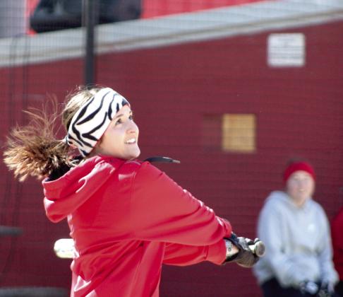 Dale 2016 graduate Taylor (Powell) Roberts sends the ball sailing during the First Annual Dale High School Alumni Slowpitch Softball Game.
