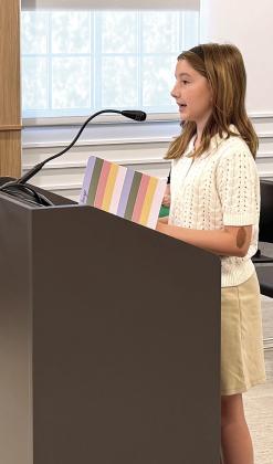 Cece Geiger, a 6th grade student at Shawnee Public Schools, encourages the County Commissioners to bring the OKC Philharmonic back to the community for a Christmas concert. Suzie Campbell, Countywide &amp;amp; Sun