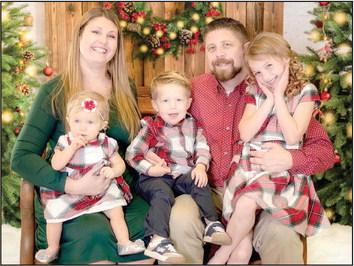 Dr. Aaron Espolt is pictured with his family above. Photo provided