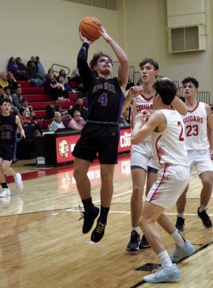 Bethel’s R.J. Morris shoots for two during the game against NRC on Jan. 12. The Wildcats fell short of the win with a score of 57-68. Countywide &amp; Sun/Julie Talton