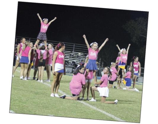 Third- through fifth- grade girls, who went to the Bethel Cheer Clinic last week, form pyramids during halftime of the Oct. 4 Bethel home game. The pre-K through second-grade group, led by the Bethel High School Cheerleaders, also performed that night. Countywide &amp; Sun/ Natasha Dunagan