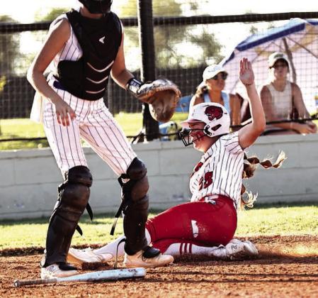 North Rock Creek’s Molly Campbell slide home for the winning run in the regionals championship game against Berryhill. Photo courtesy of Gowin Photography