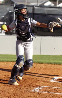 Shawnee catcher Zaleeigh Prater throws back to the pitcher in the home game with Seminole on Oct. 1. The Lady Wolves Fast-Pitch team won, 12-0. Countywide &amp; Sun/Natasha Dunagan