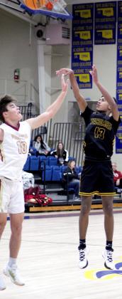Tecumseh’s Jase Edwards tries for three points during the First United Bank Classic consolation championship round in Bethel on Dec. 11. The Savages lost that hard-fought game against Byng, 51-59. They also lost the first round with Clinton, 51-73, Dec. 9, but won the second round, with McLoud, 48-36, Dec. 10. Countywide &amp;amp; Sun/Natasha Dunagan