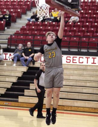 Tecumseh junior Cash Phelps makes a layup in the Class 4A Regional Consolation Bracket game against Madill, held at McLoud on Feb. 26. They won that game, 66-57, and the next game with Byng, 73-69, before falling to Mc-Loud, 50-59. The Savages end their season with a record of 15-13. Natasha Dunagan, Countywide &amp;amp; Sun