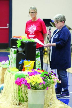 Relay for Life of Pottawatomie County Co-Chair Harriet Byers speaks during the “Re-Lei for a Cure” event on April 26, as fellow co-chair Shannon Tiger looks on.